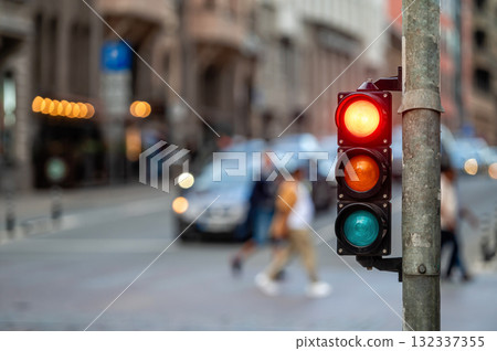 traffic light on the street junction with beautiful bokeh, city with cars in the background 132337355
