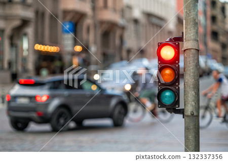 traffic light on the street junction with beautiful bokeh, city with cars in the background 132337356
