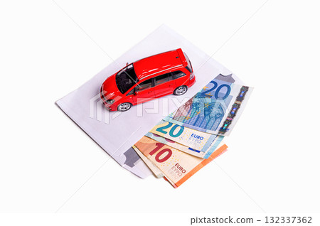 envelope with euro cash and car isolated on white, transportation cost planning concept, closeup envelope with euro cash and car isolated on white, transportation cost planning concept, closeup 132337362