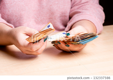 business, finance, saving, banking and people concept - close-up of woman hands counting euro money business, finance, saving, banking and people concept - close-up of woman hands counting euro money 132337386