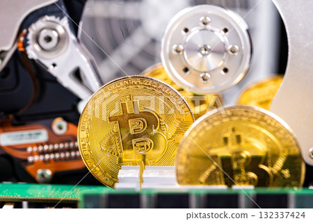 closeup of gold bitcoin on computer components background, technology and digital currency concept 132337424