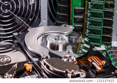 an open computer hard drive between other parts of the computer, concept of digital data security 132337425