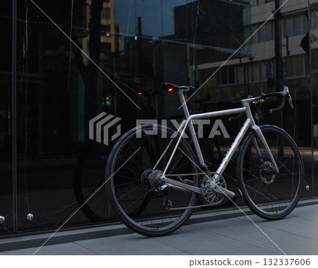 A titanium bike standing in the city early in the morning A titanium bike standing in the city early in the morning 132337606