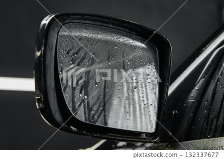 Closeup of car side mirror with water drops after washing Closeup of car side mirror with water drops after washing 132337677