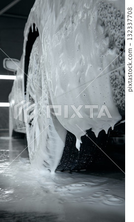 Close-up of car tire covered in thick foam during washing process Close-up of car tire covered in thick foam during washing process 132337708