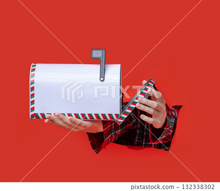 Merry Christmas. Christmas themed mailbox held in two hands through Merry Christmas. Christmas themed mailbox held in two hands through 132338302