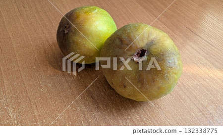 Assorted Fresh Fruits Beautifully Arranged on a Wooden Table for a Vibrant Autumn Display Assorted Fresh Fruits Beautifully Arranged on a Wooden Table for a Vibrant Autumn Display 132338775