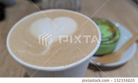 Indulge in Delicious Coffee featuring Heart Latte Art and a delightful Matcha Treat Indulge in Delicious Coffee featuring Heart Latte Art and a delightful Matcha Treat 132338820