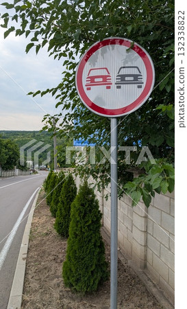 This sign indicates a designated no overtaking zone for vehicles and traffic regulations This sign indicates a designated no overtaking zone for vehicles and traffic regulations 132338822