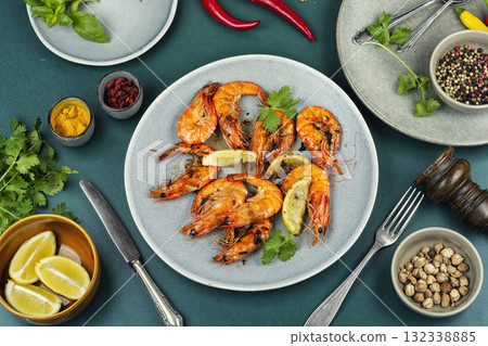 Langoustines fried in butter with garlic. Langoustines fried in butter with garlic. 132338885
