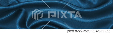 Smooth elegant blue silk or satin luxury cloth texture as abstract background. Luxurious Christmas background or New Year background design Smooth elegant blue silk or satin luxury cloth texture as abstract background. Luxurious Christmas background or New Year background design 132339832
