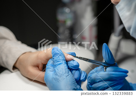 Nail care session with manicure tools demonstrating precision and attention to detail in a beauty salon Nail care session with manicure tools demonstrating precision and attention to detail in a beauty salon 132339883