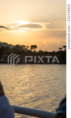 Sunset over the Bosphorus highlighting cliffs and trees with a tranquil water view Sunset over the Bosphorus highlighting cliffs and trees with a tranquil water view 132339922