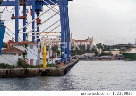 Bosphorus waterfront with industrial structures and distant historical architecture at twilight Bosphorus waterfront with industrial structures and distant historical architecture at twilight 132339925