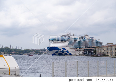 Cruise ship docked in the Bosphorus with Istanbul skyline in the background during an overcast day Cruise ship docked in the Bosphorus with Istanbul skyline in the background during an overcast day 132339933