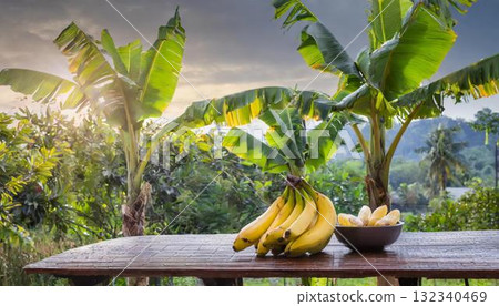 banana on wooden table in tropical garden 132340469
