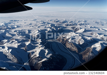 Greenland icebergs and glaciers seen from an airplane window 132340604
