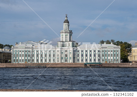 Historic building along the water in Saint Petersburg showcasing classic architecture and vibrant greenery under a clear sky Historic building along the water in Saint Petersburg showcasing classic architecture and vibrant greenery under a clear sky 132341102