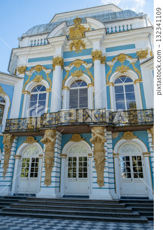 Exploring the grandeur of Catherine Palace with intricate architecture and lush gardens in Tsarskoye Selo on a clear sunny day 132341109