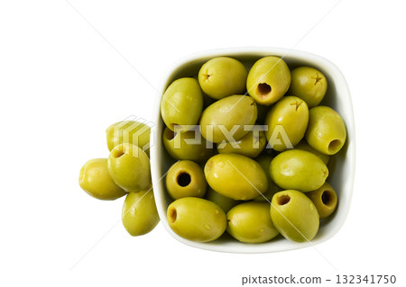 Ceramic bowl with pickled pitted green olives isolated on a white background, top view. Ceramic bowl with pickled pitted green olives isolated on a white background, top view. 132341750