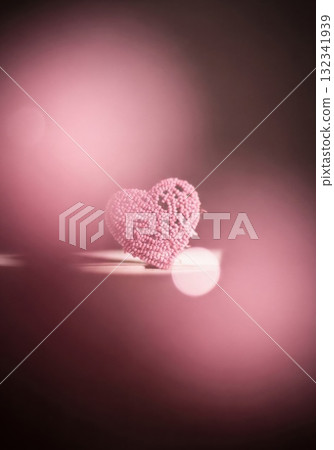 Pink Heart with Shadow Displayed on Dark Background 132341939