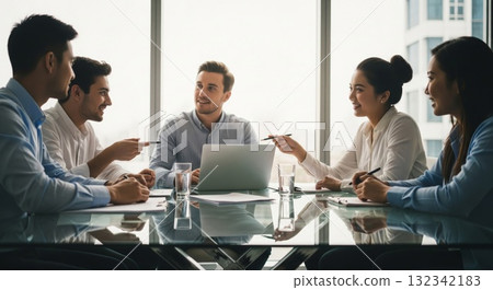 Diverse Professionals Collaborating Around Table in Bright Conference Diverse Professionals Collaborating Around Table in Bright Conference 132342183