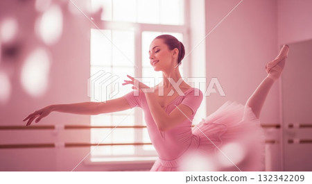 Graceful Ballerina in Pink Tutu Performing in a Light Filled Studio 132342209