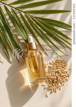 Natural oil dropper bottle with palm leaves and grains, symbolizing isolation and exclusion 132343161