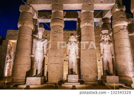Night Interior of Luxor Temple Egypt Pharaoh Statues Between Ancient Columns. Night Interior of Luxor Temple Egypt Pharaoh Statues Between Ancient Columns. 132343329