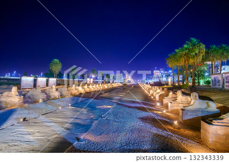 Sphinx Avenue at Luxor Temple Egypt Illuminated at Night with Palm Trees. 132343339