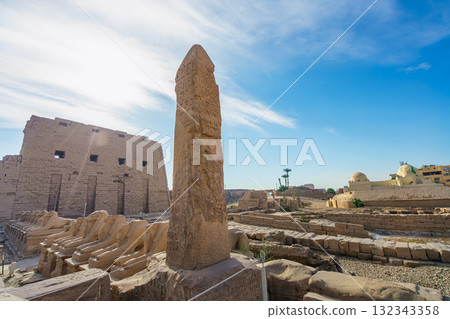 Obelisk and ram headed sphinxes at Karnak Temple Complex Luxor Egypt. 132343358