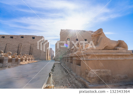 Morning sunlight over the Avenue of Sphinxes at the Temple of Karnak in Egypt. Morning sunlight over the Avenue of Sphinxes at the Temple of Karnak in Egypt. 132343364