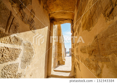 Ancient passage in Temple of Karnak Luxor Egypt leading to bright outside. 132343384