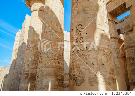 Papyrus columns and hieroglyphs in the Great Hypostyle Hall Karnak Temple Luxor. 132343394