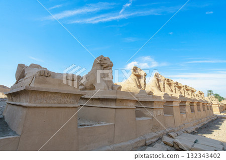 Ram-Headed Sphinxes Line Entrance of Temple of Karnak Luxor Egypt. Ram-Headed Sphinxes Line Entrance of Temple of Karnak Luxor Egypt. 132343402