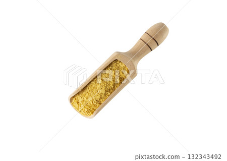 Savoury vegan yeast flakes in wooden scoop isolated on white background. Savoury vegan yeast flakes in wooden scoop isolated on white background. 132343492