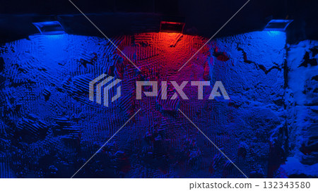Rough plaster wall lit by blue and red spotlights, heavy texture and moody color creating dramatic abstract backdrop Rough plaster wall lit by blue and red spotlights, heavy texture and moody color creating dramatic abstract backdrop 132343580