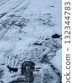 Shoe prints on frozen asphalt 132344783