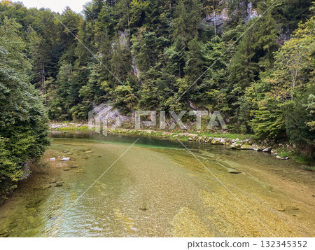 Peaceful Mountain River Flowing Calmly Through Valley Peaceful Mountain River Flowing Calmly Through Valley 132345352