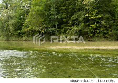 Peaceful River Flowing Calmly Through Valley Peaceful River Flowing Calmly Through Valley 132345369