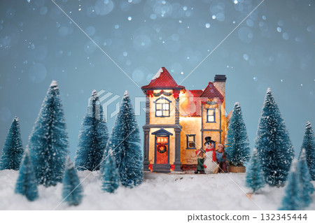 Christmas box among winter trees, Decorative red box with holiday ornaments in snowy woodland scene Christmas box among winter trees, Decorative red box with holiday ornaments in snowy woodland scene 132345444