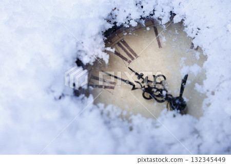 Snowy antique clock, Faded winter clock in snow, Silent snowcovered clock illustrating time Snowy antique clock, Faded winter clock in snow, Silent snowcovered clock illustrating time 132345449