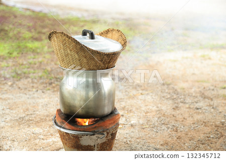 streamed cooked stove for making sticky rice on hot stove in 132345712