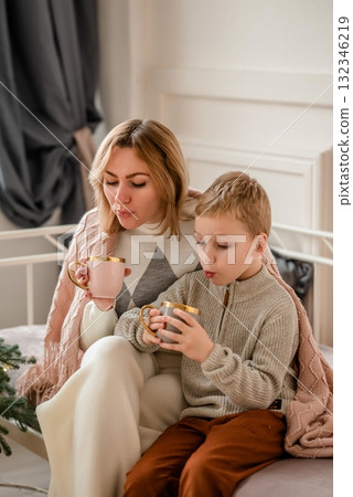 Mother and Child Enjoying Warm Beverages Together Mother and Child Enjoying Warm Beverages Together 132346219