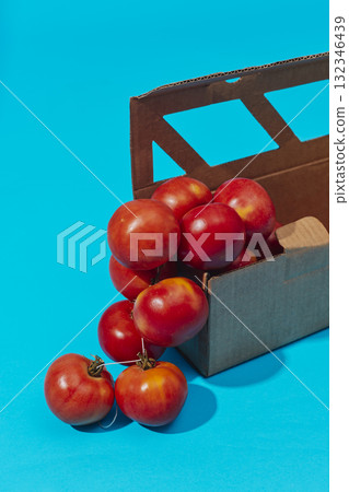 vertical string of tomatoes in a box vertical string of tomatoes in a box 132346439