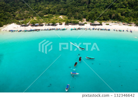 Bird's eye view of Redang Island with a tropical beach and tourist boats off the coast 132346642