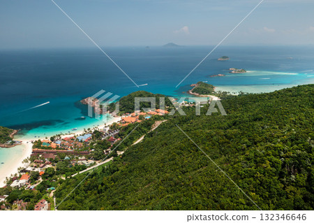 A tropical beach in the popular Redang Island resort with clear turquoise waters and lush greenery surrounded by small islands. Malaysia A tropical beach in the popular Redang Island resort with clear turquoise waters and lush greenery surrounded by small islands. Malaysia 132346646