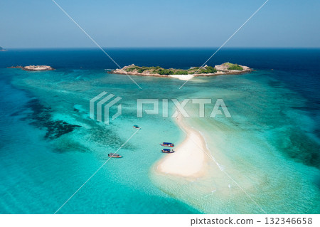 View from the height of the sandy spit with clear blue water, boats and tourists. Redang Island. Malaysia 132346658