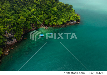 Tourists go snorkeling in Kilim Geopark near Langkawi Island. Boats with tourists in Kilim Park on Langkawi Island. Malaysia Tourists go snorkeling in Kilim Geopark near Langkawi Island. Boats with tourists in Kilim Park on Langkawi Island. Malaysia 132346690