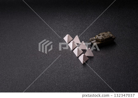 Anti-tank barrier or dragon's teeth made of concrete and iron as a fortification. Dragon's teeth 132347037